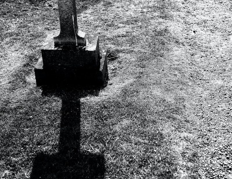 grayscale photography of gray tombstone